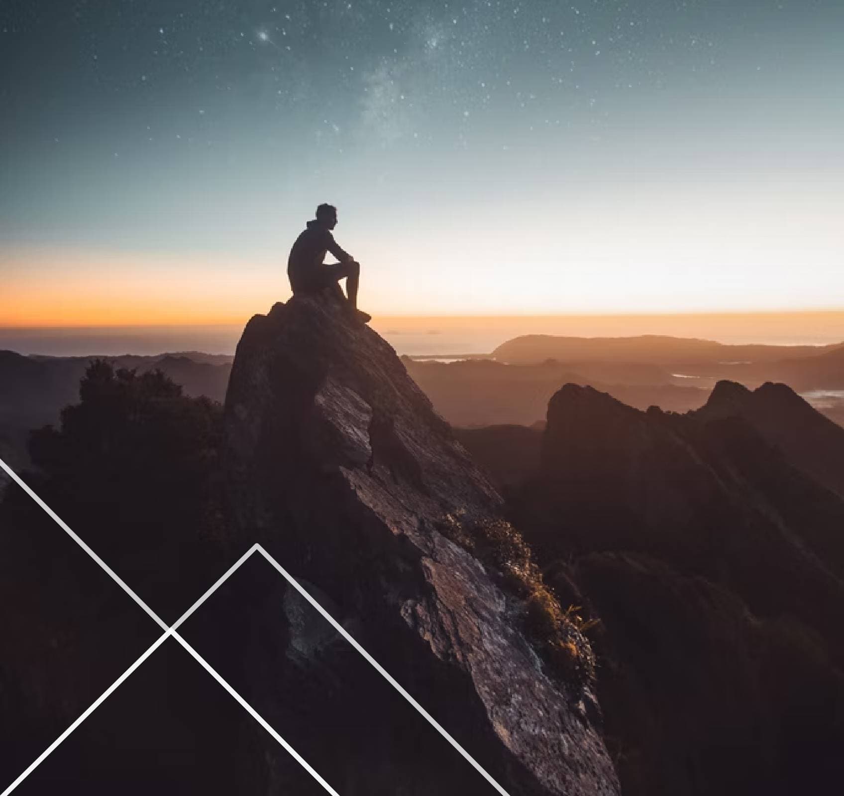 Person sitting on mountaintop