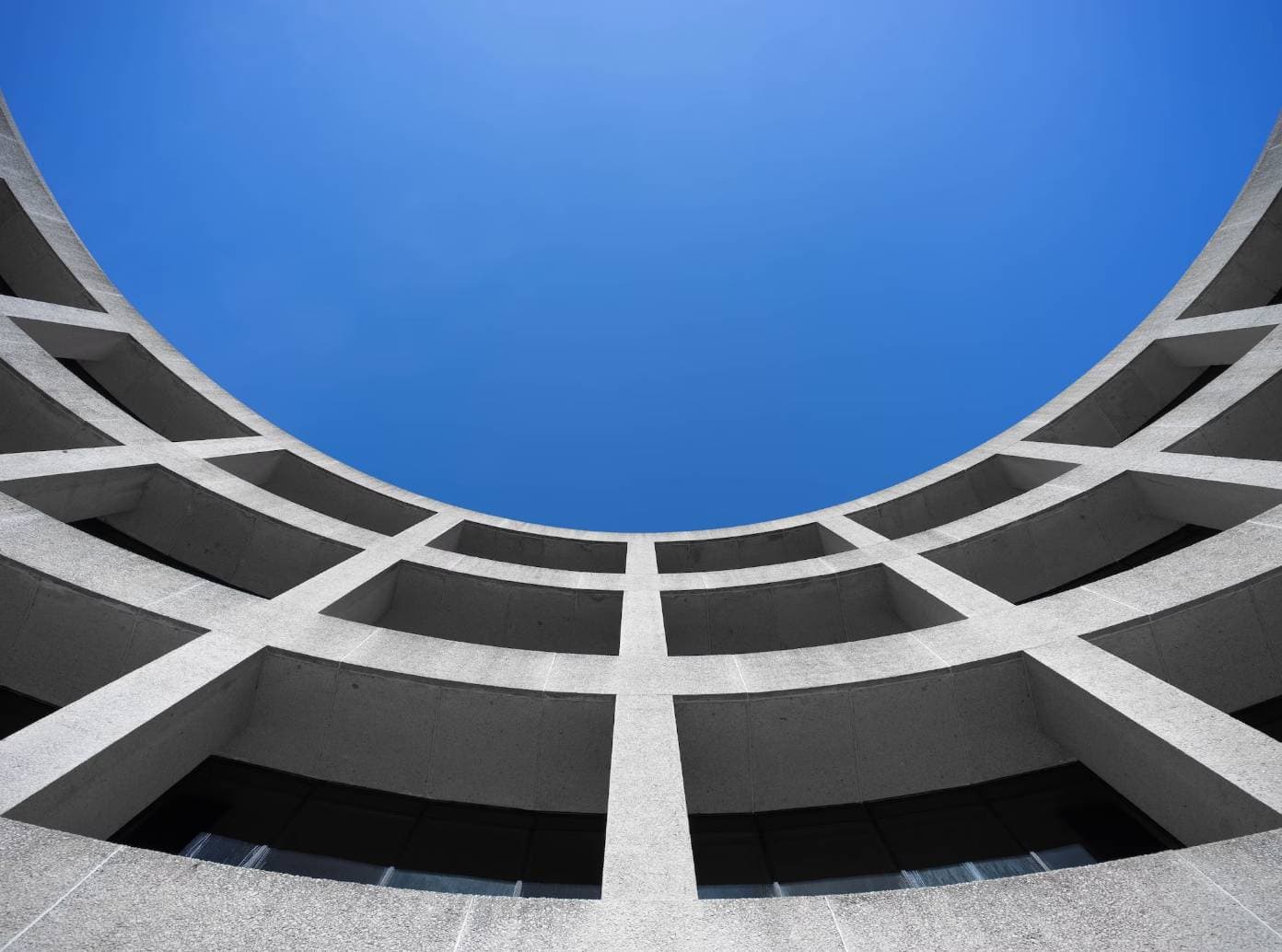 Curved building with blue sky