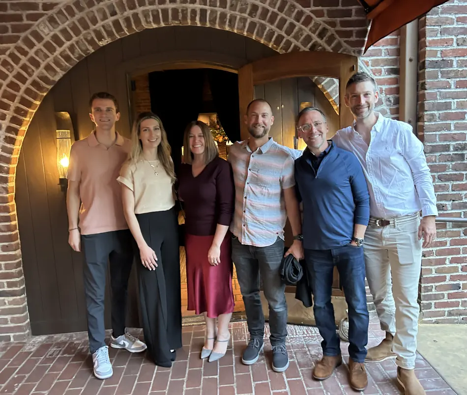 Highcamp Compliance team standing in archway